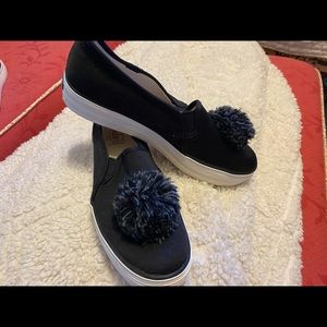 Keds black canvas slip on with pom pom.
